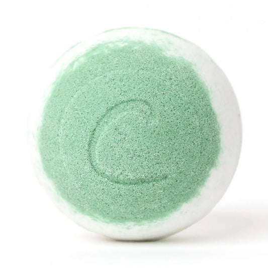 Round white and lime green bath bomb with a textured surface and a subtle letter C embossed on the front.