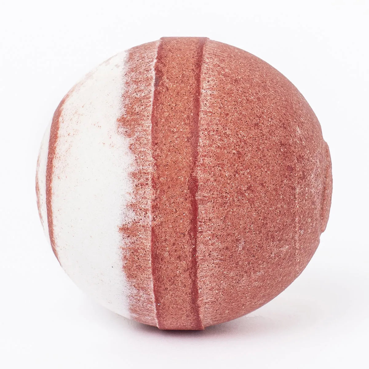 Round Hibiscus Passion bath bomb with a textured, two-tone design featuring deep red and creamy white stripes.